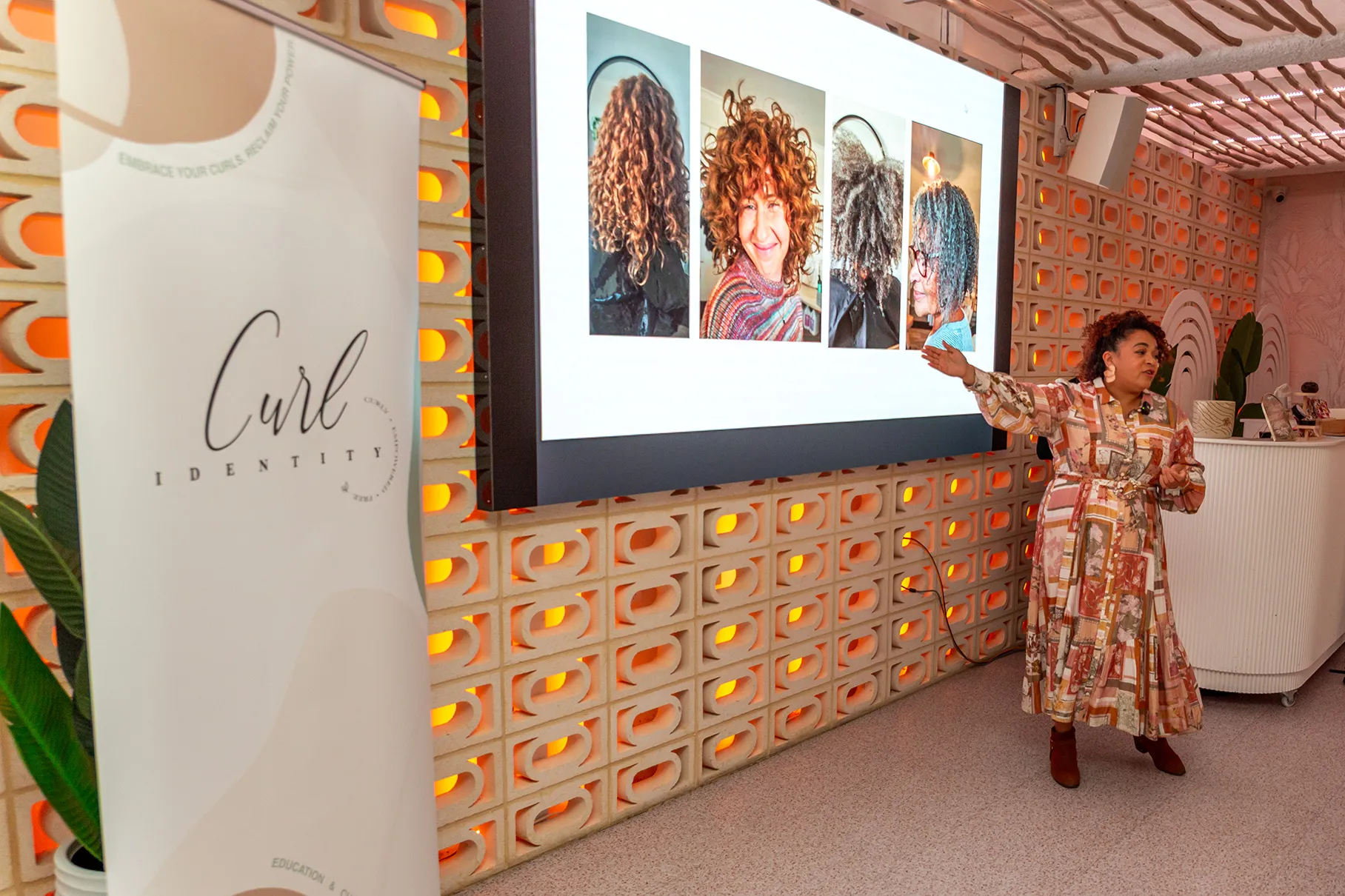Caroline speaking at the Curls Connection event