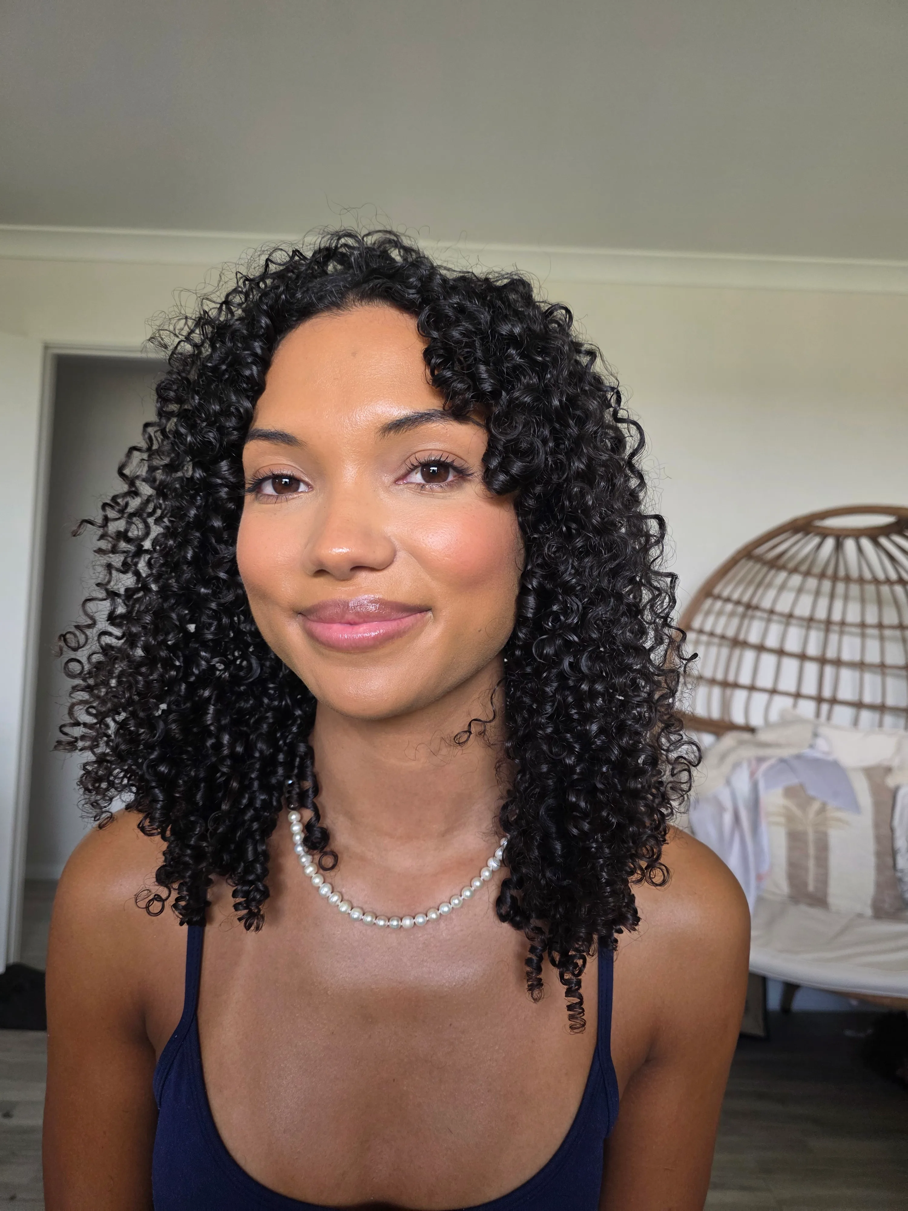 Defined dark curls after a Curl Identity studio session