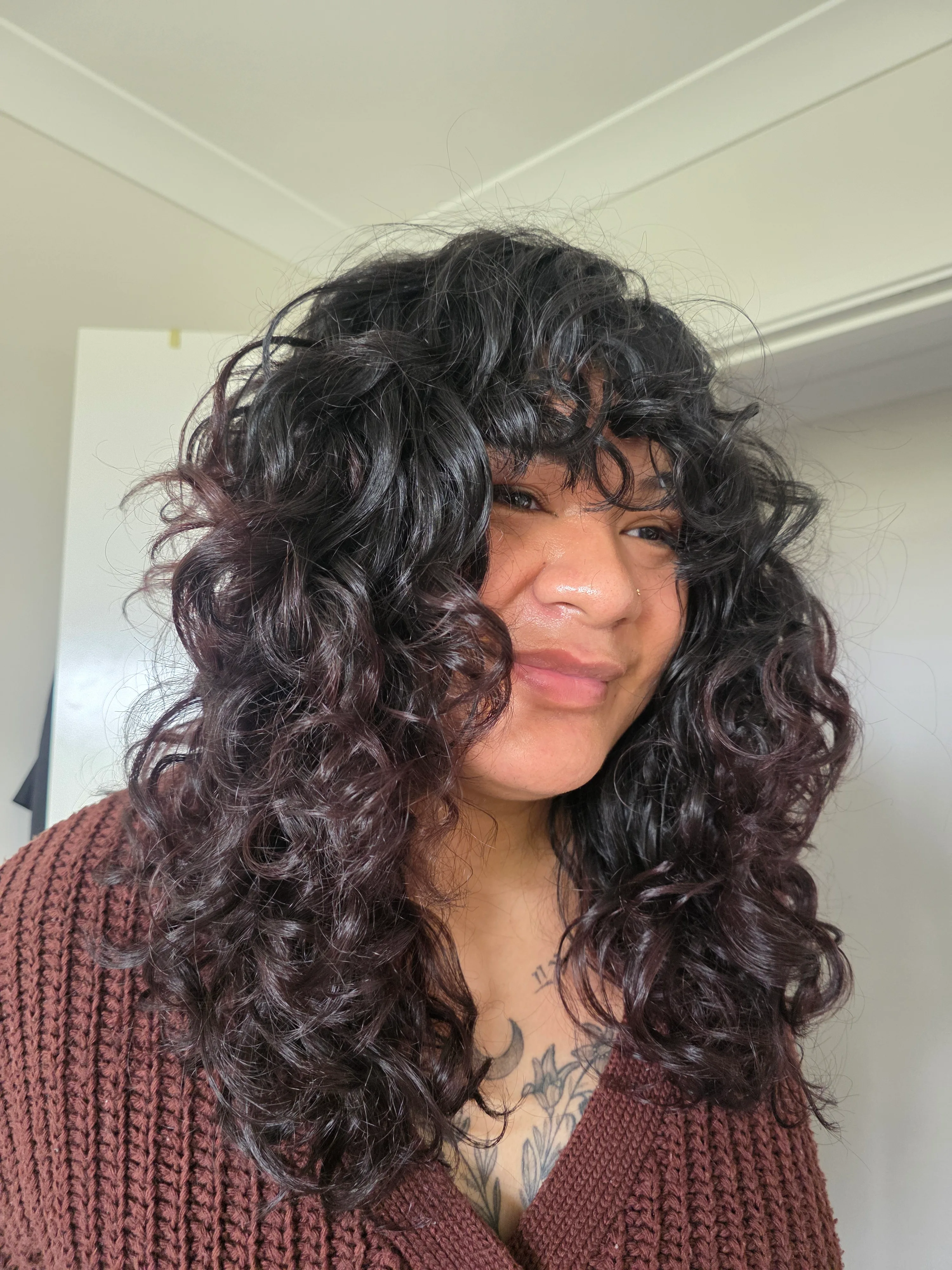 Long defined curls styled at Curl Identity